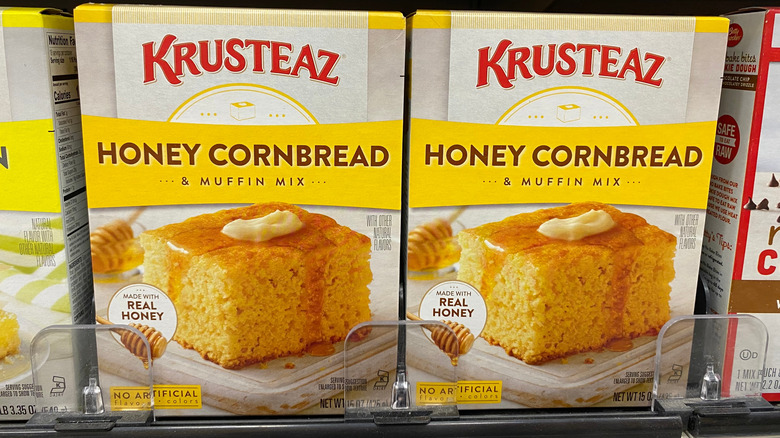 Krusteaz Honey Cornbread & Muffin Mix in a boxes on a grocery store shelf.