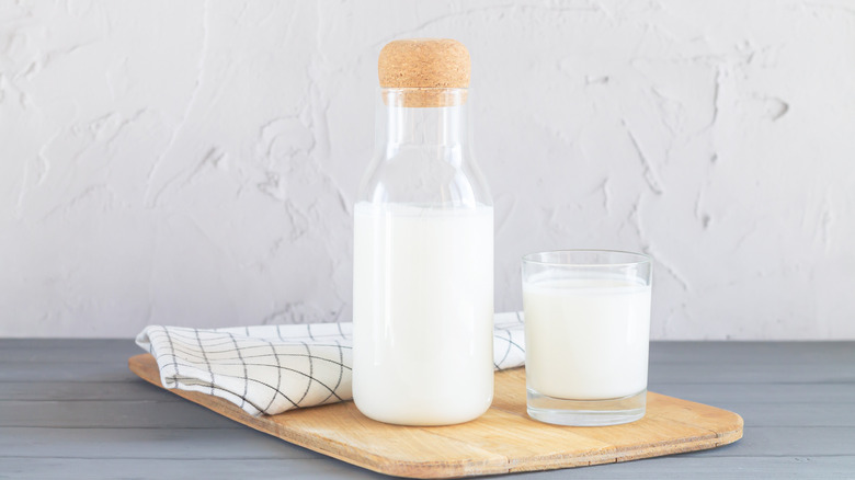 jar and glass of milk on counter