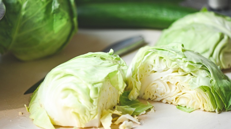 Fresh green cabbage wedges on a cutting board