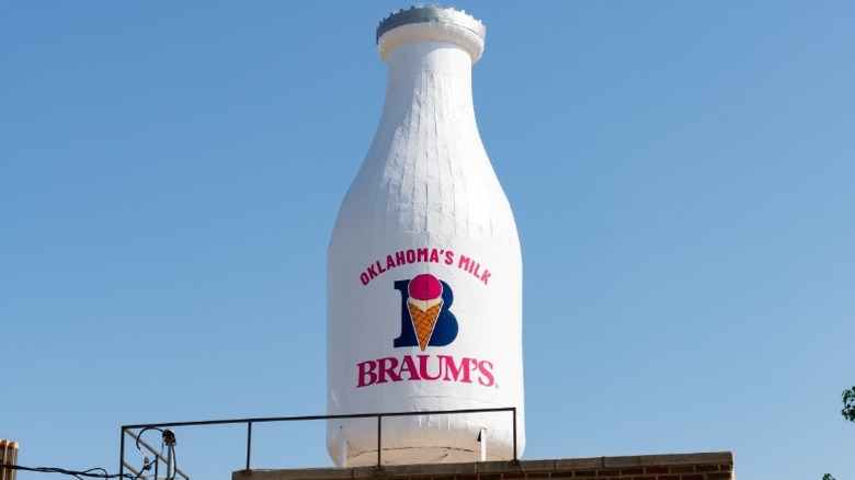 The historic Braum's dairy bottle statue on top of a building in Oklahoma.