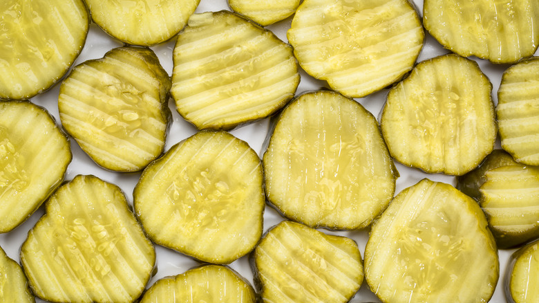Pickle slices on a white background