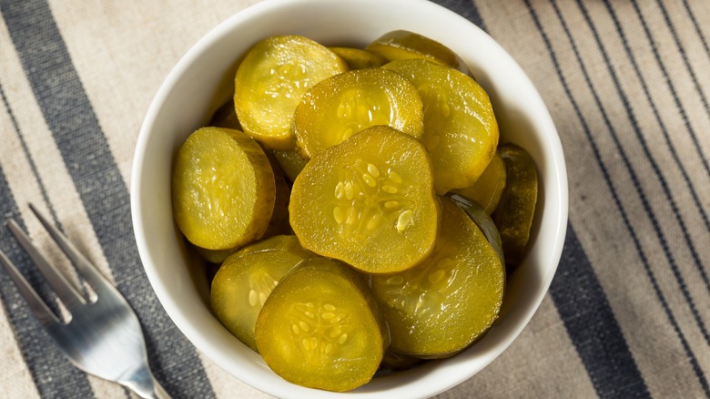 Bread and butter pickles in a bowl