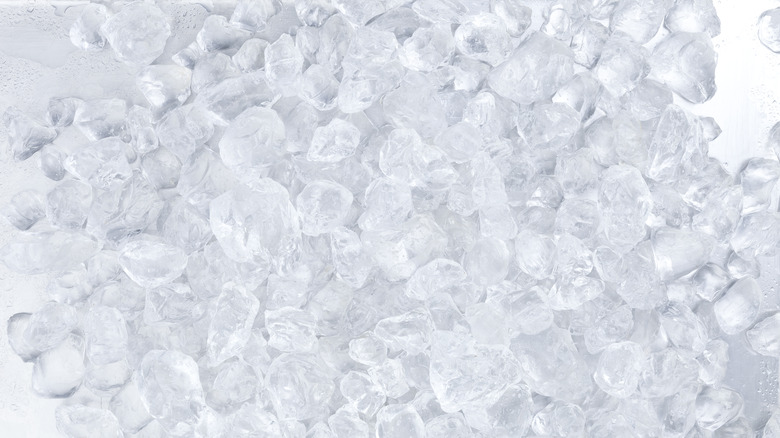 A plastic bag of ice with ice cubes on white background.