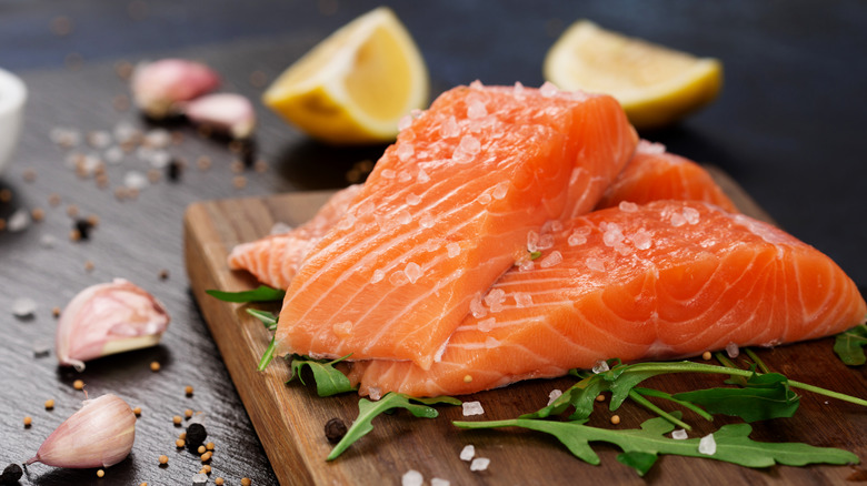 Salmon fillets with large flakes of salt for dry brine