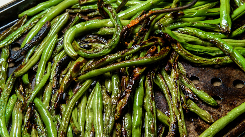 Charred and crispy green beans in a sheet pan
