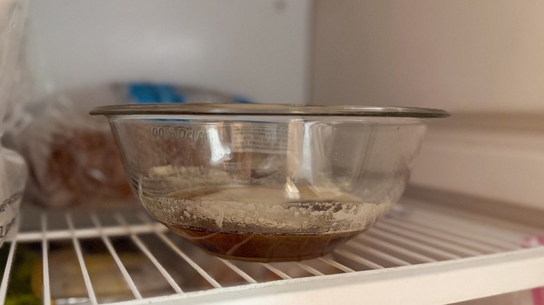 Brown butter cooling in glass bowl in freezer