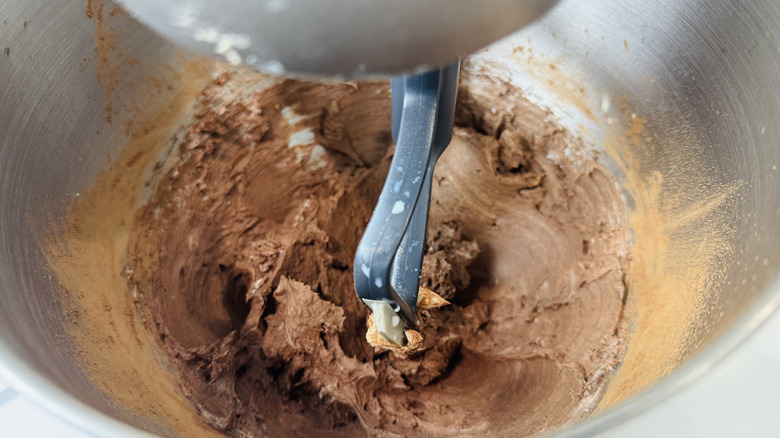Thick chocolate batter in stand mixer bowl