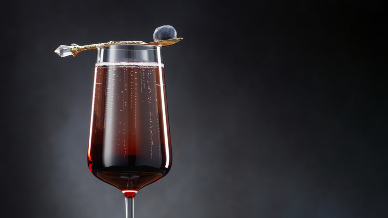 Kir Royale garnished with blueberry