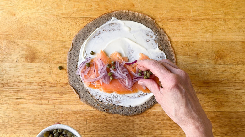 Buckwheat crepe with creme fraiche, smoked salmon, red onion, and capers