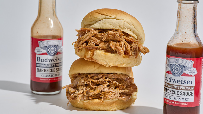 Pulled pork sandwiches stacked on top of each other on a table