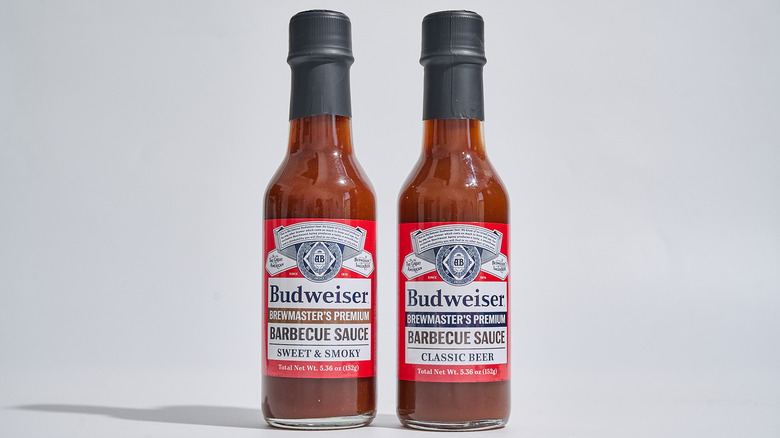 Budweiser barbecue sauces in bottles on a table