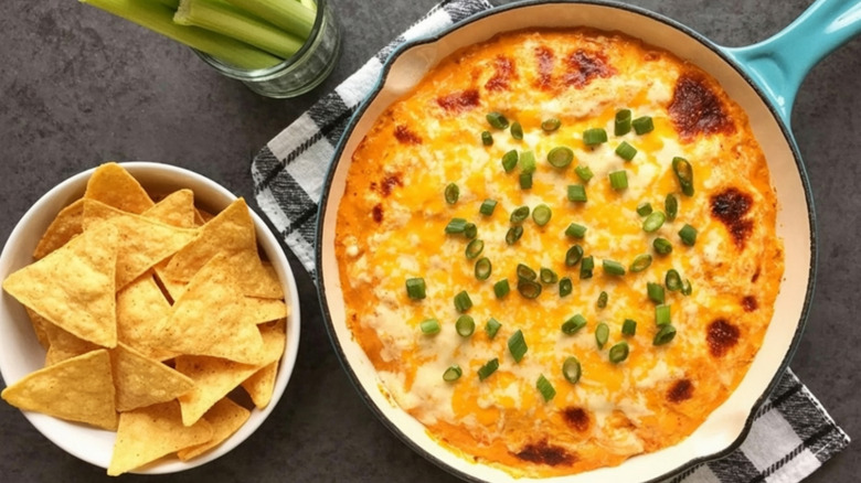 Buffalo chicken dip with a side of chips.