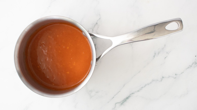 A composed buffalo sauce in a medium saucepan.