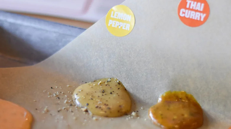 A small drop of Buffalo Wild Wings lemon pepper sauce and Thai curry sauce