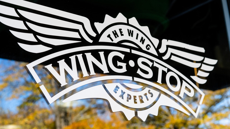 Exterior glass sign at a Wingstop restaurant