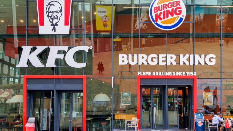 A Burger King restaurant and a KFC restaurant next to each other.