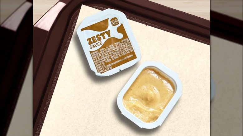 Burger King's zesty sauce sitting on a plastic tray