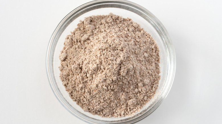 Close up of wooden bowl of au jus dry mix in a bowl