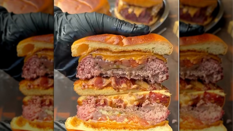 Finished Mason jar burgers, showing fillings inside meat