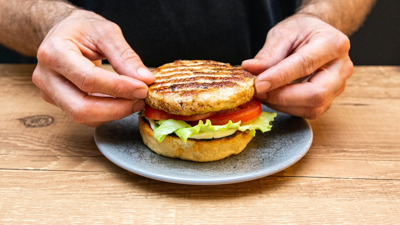 chef prepares a hamburger