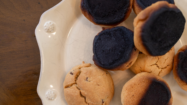 plate of cookies that were burned on the bottom