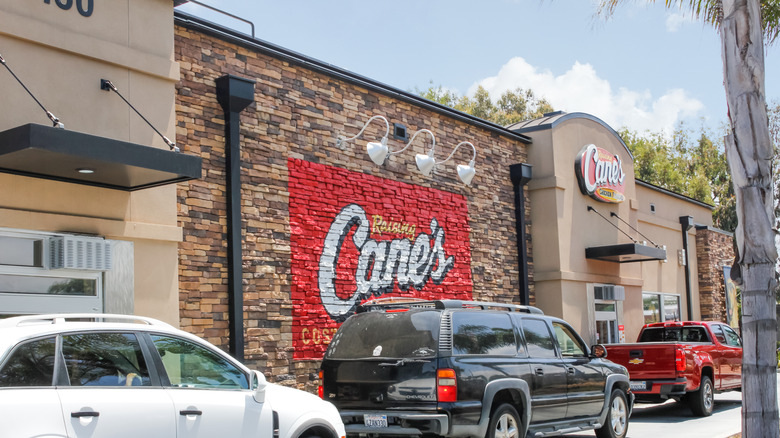Cars waiting in Raising Cane's drive thru line