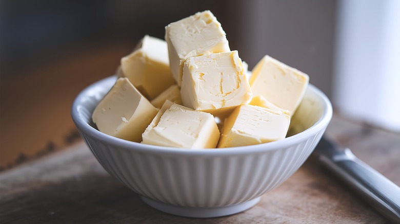 Bowl of white butter cubes.