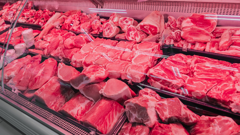 A butcher case full of various beef cuts.