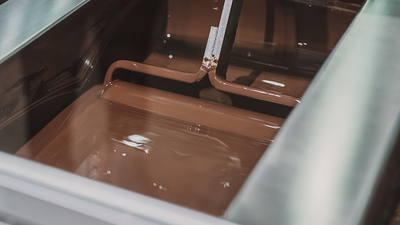 Liquid chocolate being processed in a factory