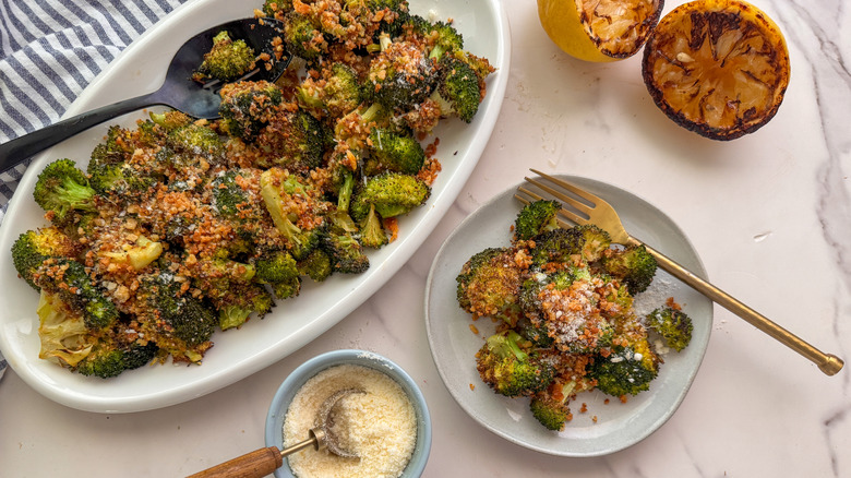 Breadcrumb-topped broccoli on serving platter and plate