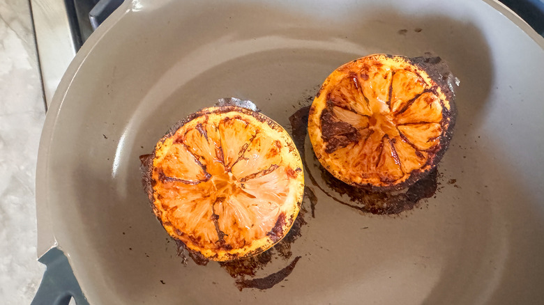charred lemons in pan