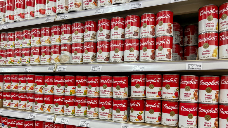 Grocery store shelves filled with various Campbell's soups