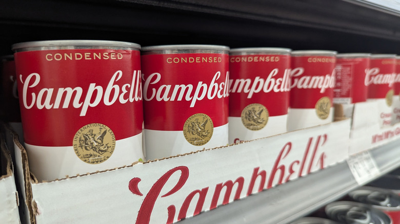 Cans of Campbell's soup on the shelf at a store