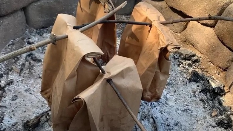 brown paper bags over a campfire