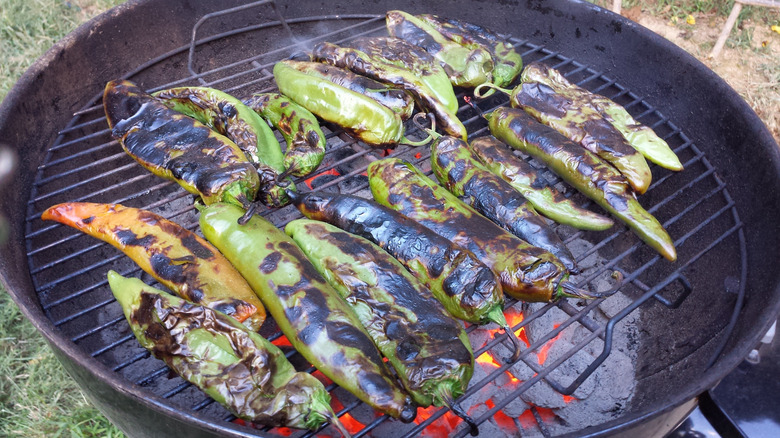 Charred Hatch chiles on a grill