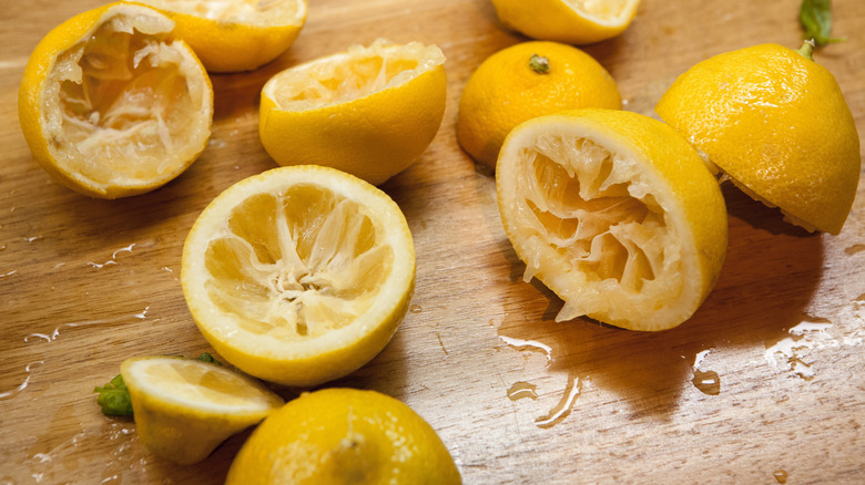 Lemon peels laying on wood