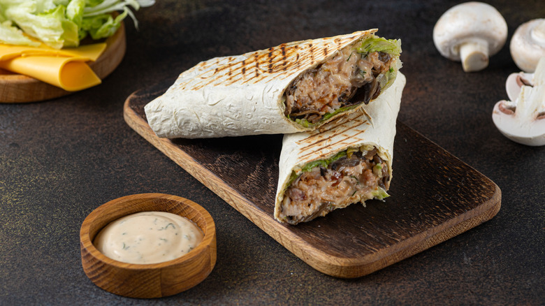 freshly rolled shawarma sandwich on a plate