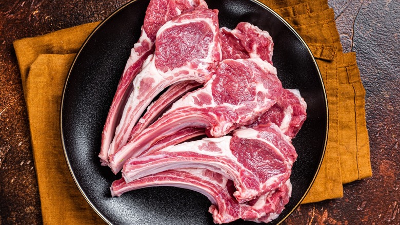 Raw lamb chops on a plate