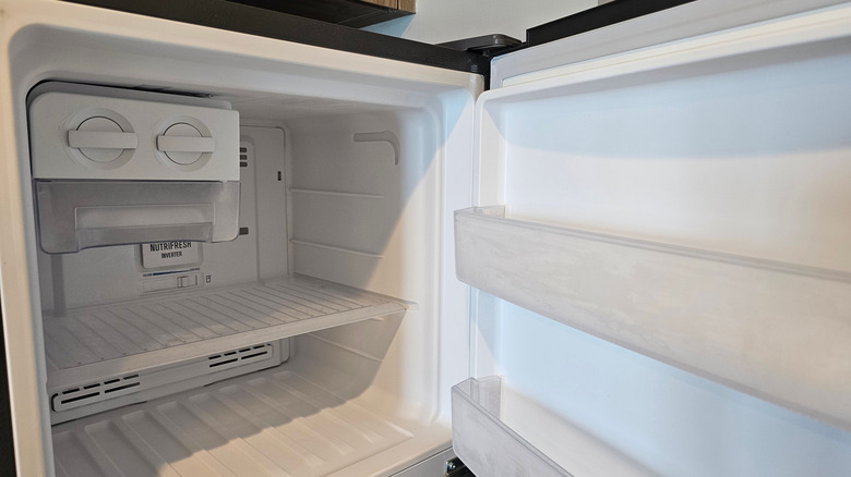 open and empty refrigerator freezer