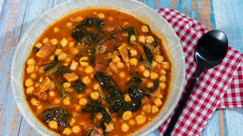 A bowl of Spanish-style chickpea and spinach stew.