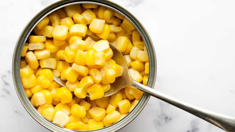 a close-up of an open can of sweet corn