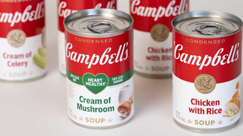 Cans of Campbell's condensed soups on a white surface