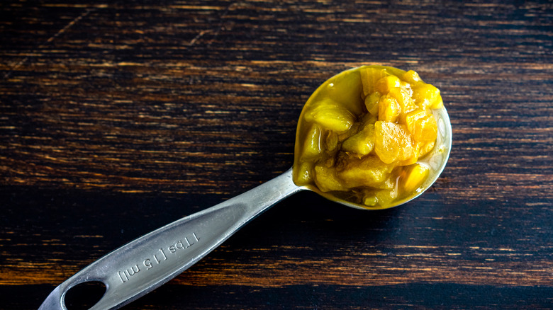 Green chiles on spoon
