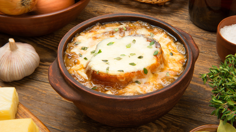 Bowl of French onion soup with bread on top