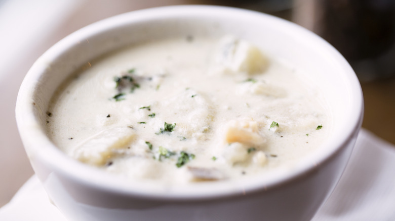Clam chowder in a white bowl