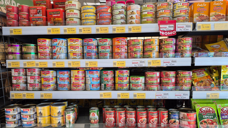 Cans of meat on a store shelf