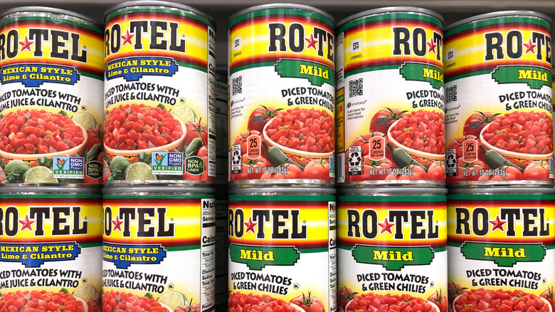 Grocery store shelf with cans of Rotel brand diced tomatoes