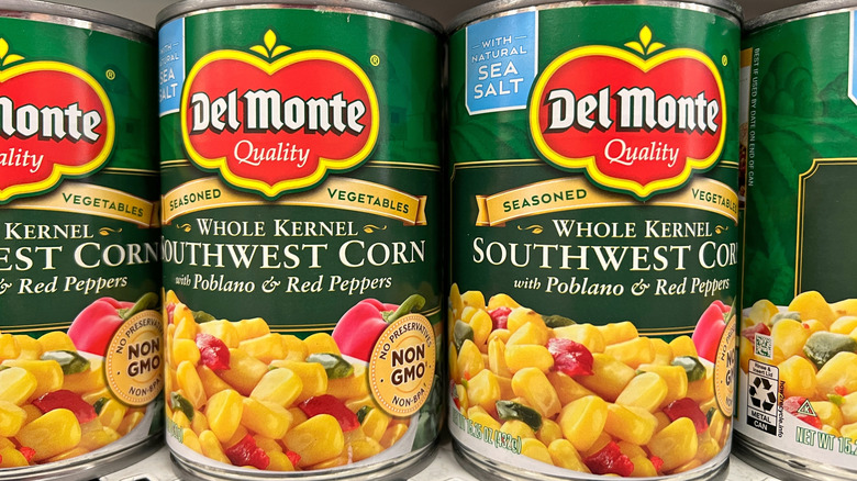 Grocery store shelf with cans of Del Monte brand whole kernel Southwest Corn
