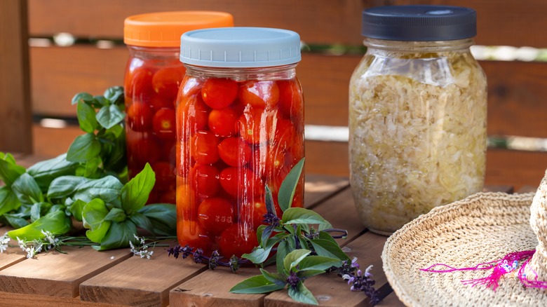 Canned and vacuum-sealed mason jars with food