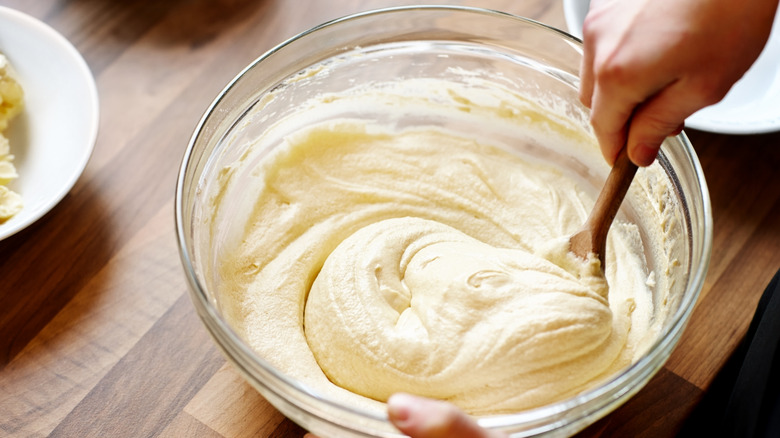 Person mixing batter in a bowl